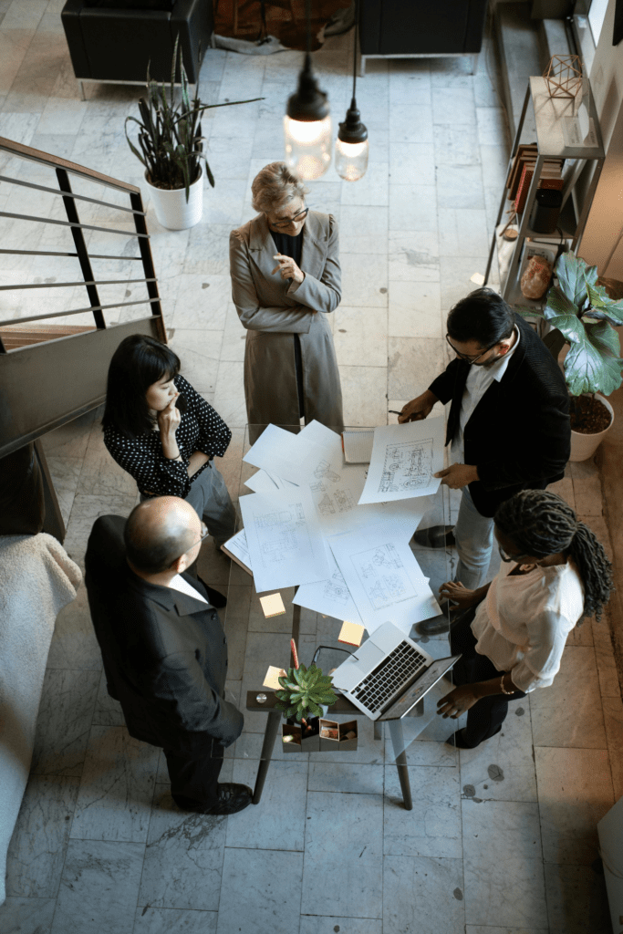 People sitting on chairs in front of the table