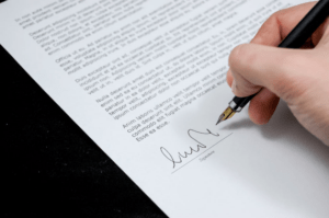 A person signing a legal contract