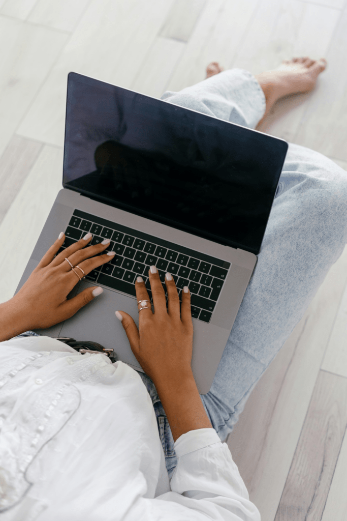 A photo of a person using a laptop