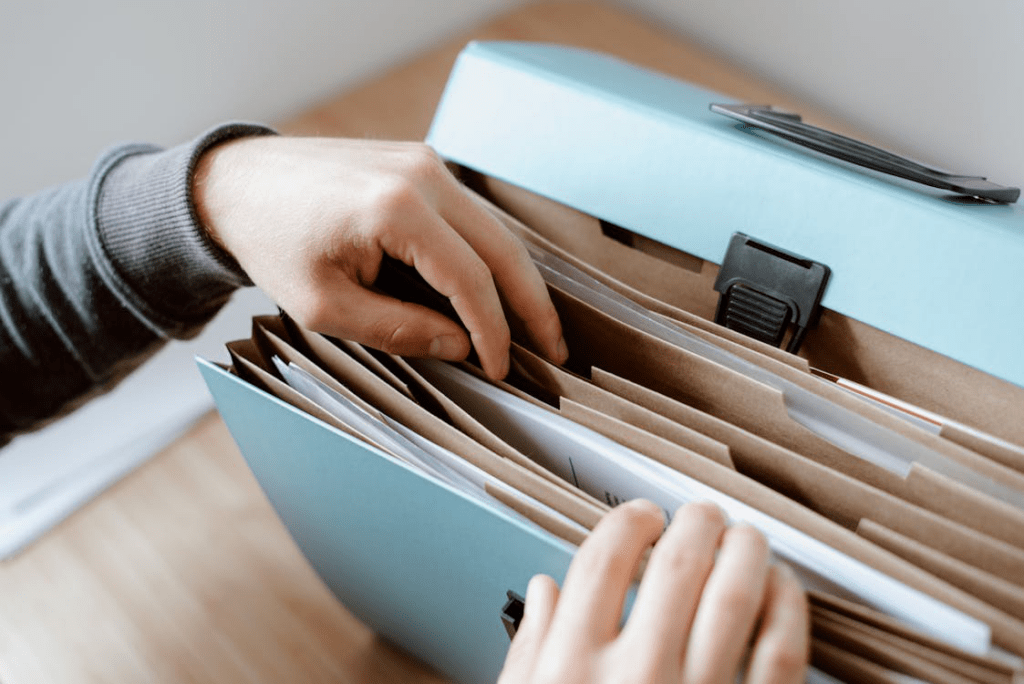 A person finding legal translation documents in a folder