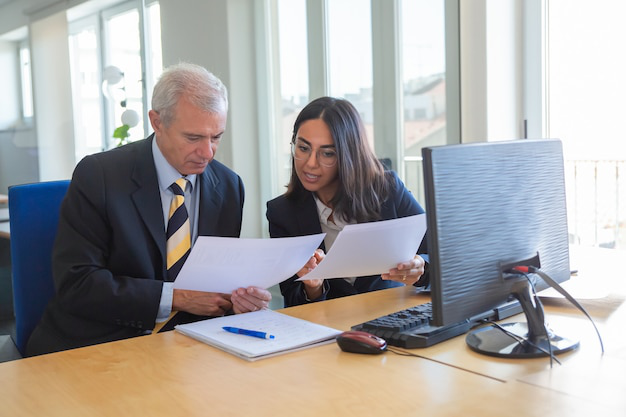 Professional translator discussing USCIS document requirements with a client