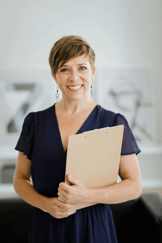 A woman holds an academic document