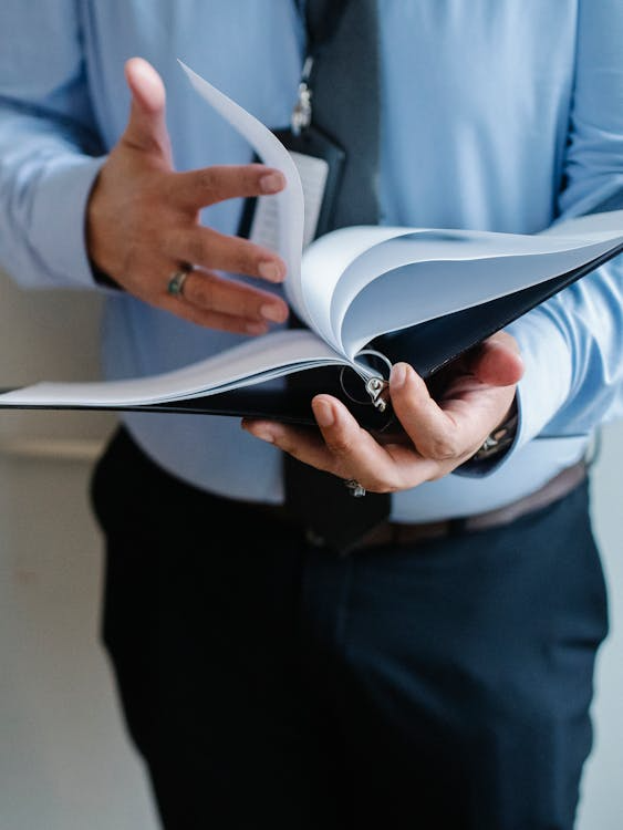 a man holding a report 