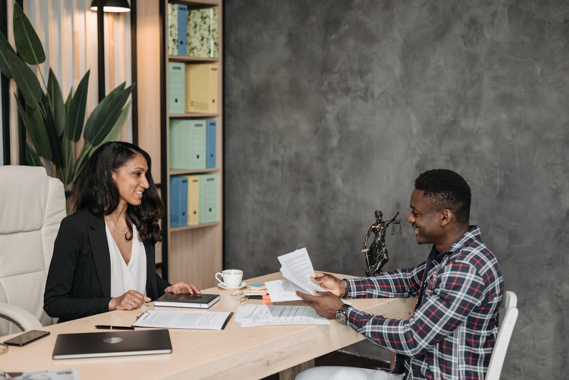 Two people going over legal documents