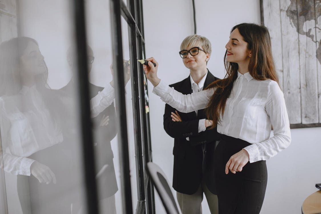 two women in business attire.