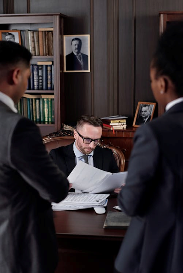 a man sitting and going through documents.