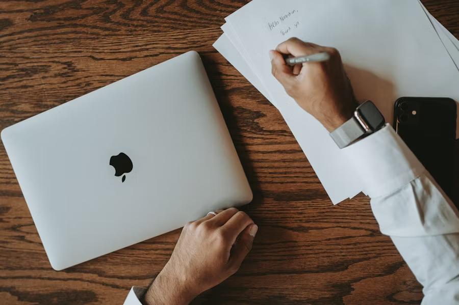  A man manually translates a document.