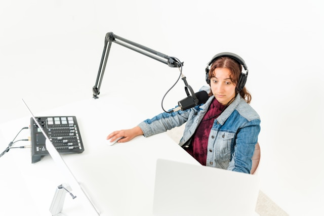 This photo shows a woman using a microphone for communication