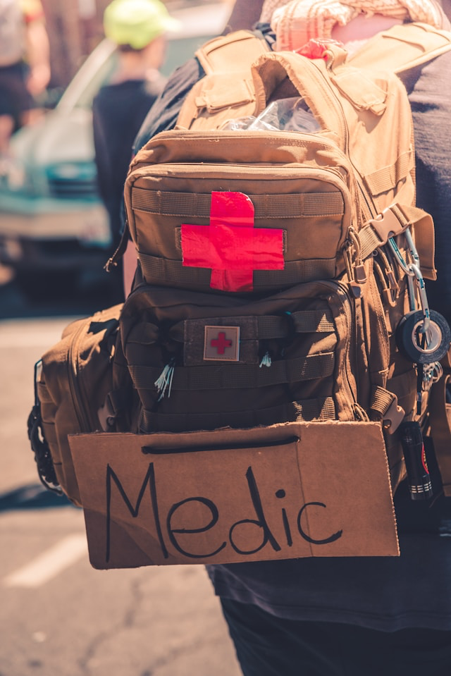 This photo shows a large travel bag marked with a red medical cross