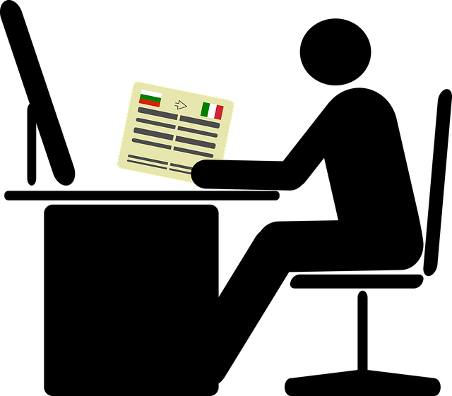  This photo shows a person working at a desk with documents