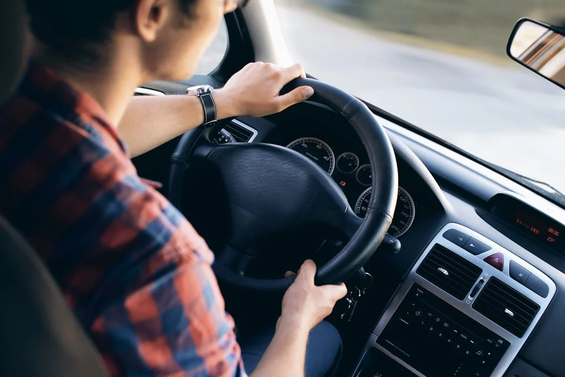 a man driving a car 