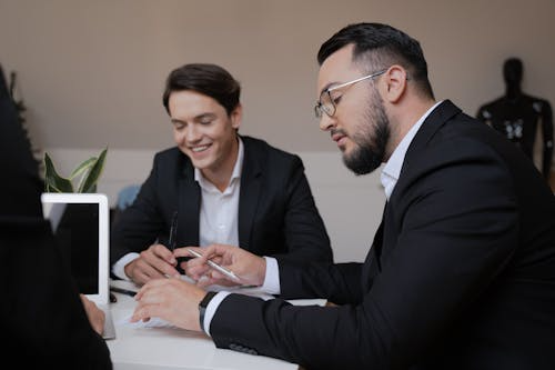 Immigration lawyer consulting a certified translator to expedite refugee reunification cases.