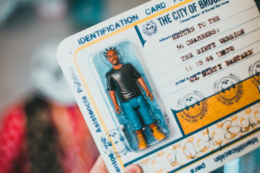  a person holding an ID card