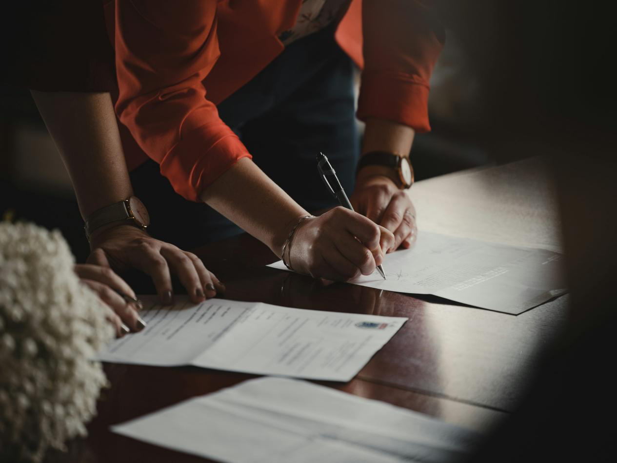 Person filling out forms