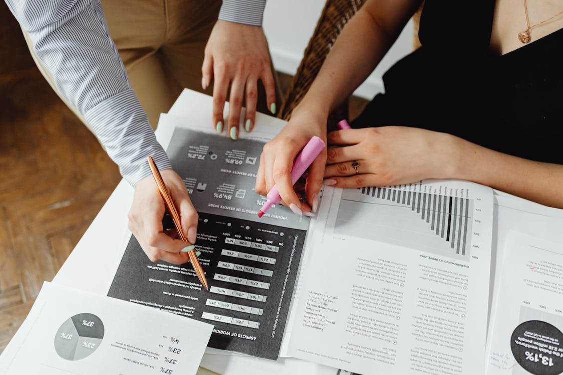 Close-up of accounting reports and charts requiring precise financial translation for international compliance