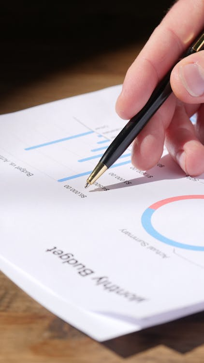 Close-up of pen marking financial report illustrating expert financial translation for audits and cross-border filings