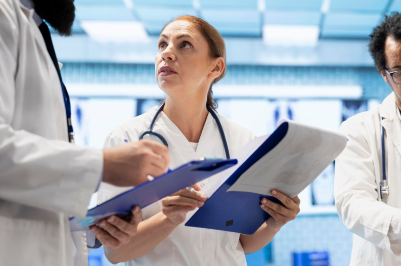 Team of doctors comparing test results and healthcare records to ensure accurate medical translation and clinical decision-making.