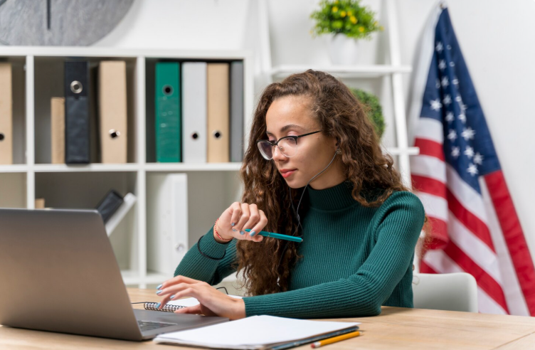 Translator carefully analyzing document stamps and annotations using a laptop