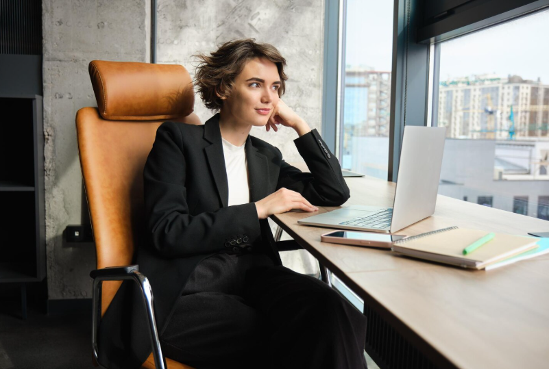  Translator working on a laptop performing quality control for legal document translation